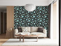 A patterned wallpaper with turquoise geode-style forms outlined in deep, earthy rings.