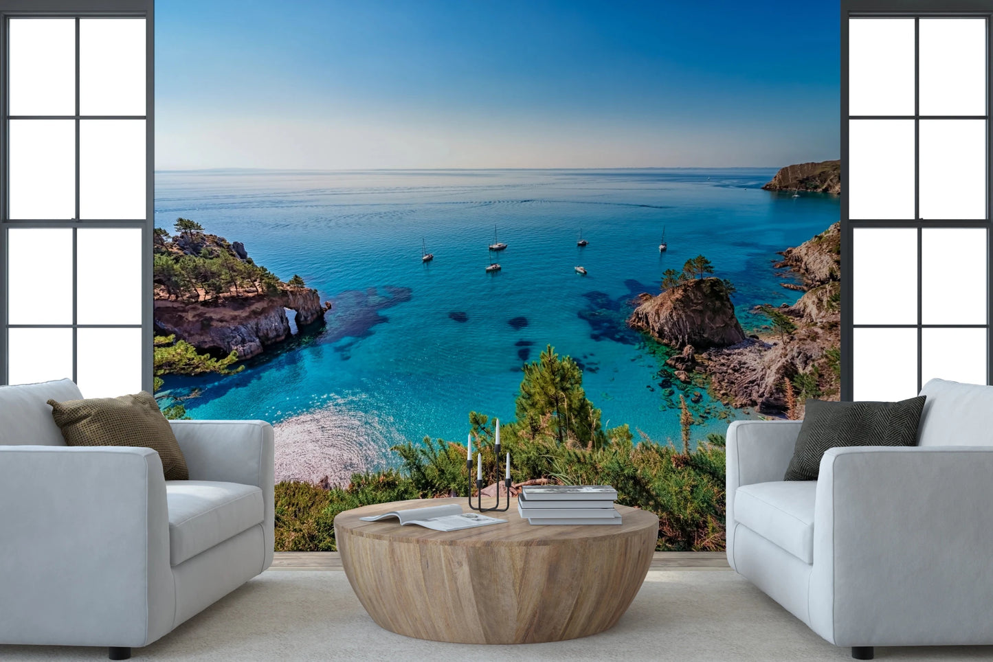 Turquoise Cove Escape wallpaper mural of the bay framed behind two white armchairs and a round wood table
