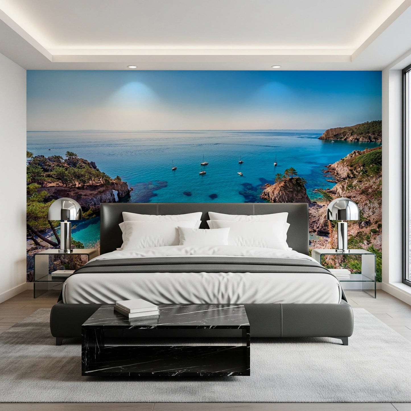 Turquoise Cove Escape wallpaper mural with turquoise water behind a grey bed and chrome bedside lamps