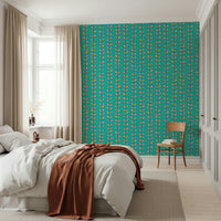 Colorful leaf motifs arranged along upward vine stripes giving the wallpaper a cheerful vintage look.