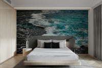 An artistic seaside scene mural on minimalist wallpaper.

