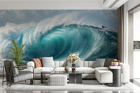 Turquoise Surge wallpaper mural of a curling ocean wave behind a white sectional and grey chair in a living room