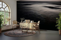 A graceful subtle gradient wall mural in cool, dark tones.

