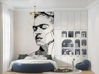 Unbroken wallpaper mural with a line-art woman's portrait behind a round navy bed in a child's bedroom