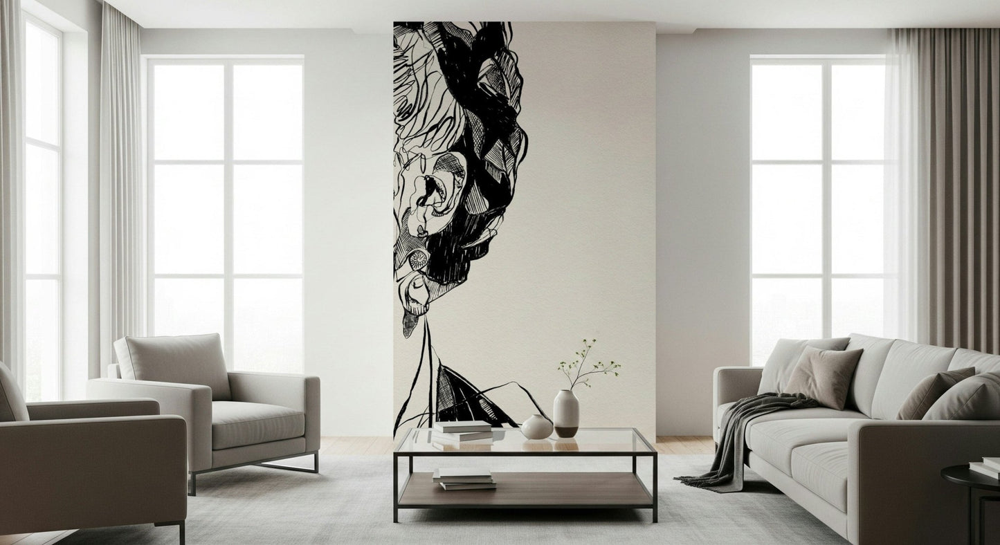Unbroken wallpaper mural showing a cropped sketched face on cream behind gray armchairs and a glass coffee table