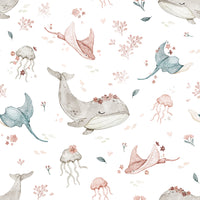 Underwater Floral wallpaper close-up showing watercolor whales, rays and jellyfish with pink flowers on white
