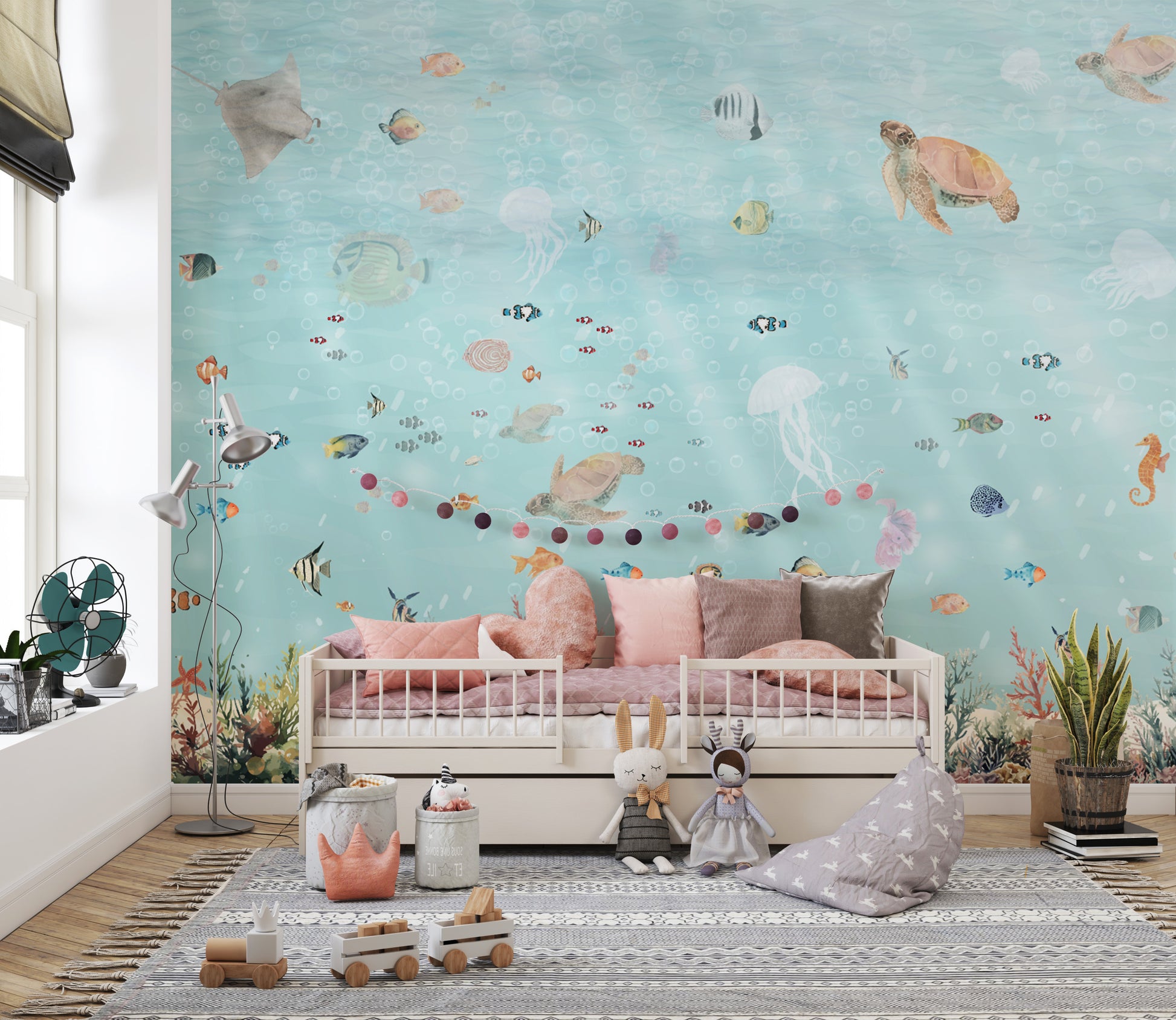 Underwater Marine Life wallpaper mural of sea turtles and jellyfish above a white kids daybed and plush toys