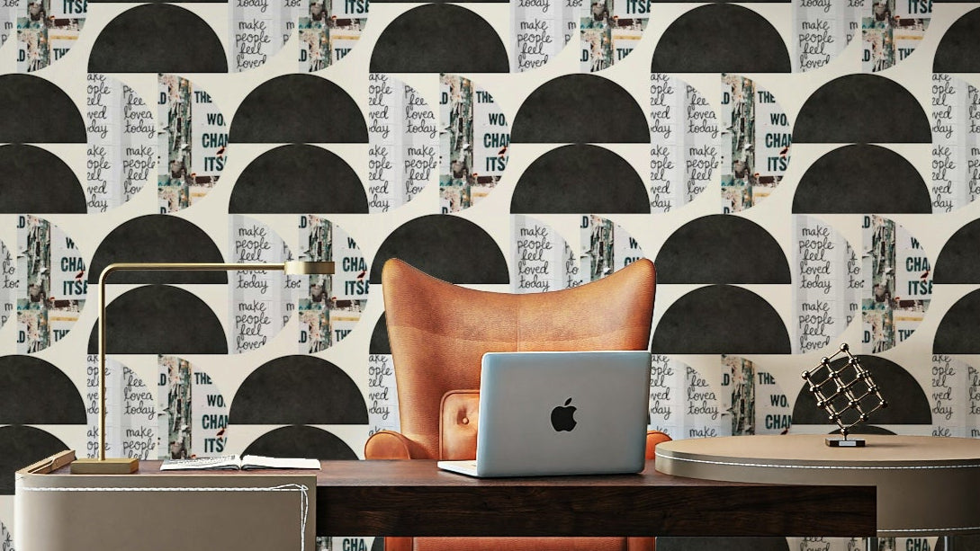 Urban Echoes wallpaper with black domes and poster-text collage behind an orange armchair and desk