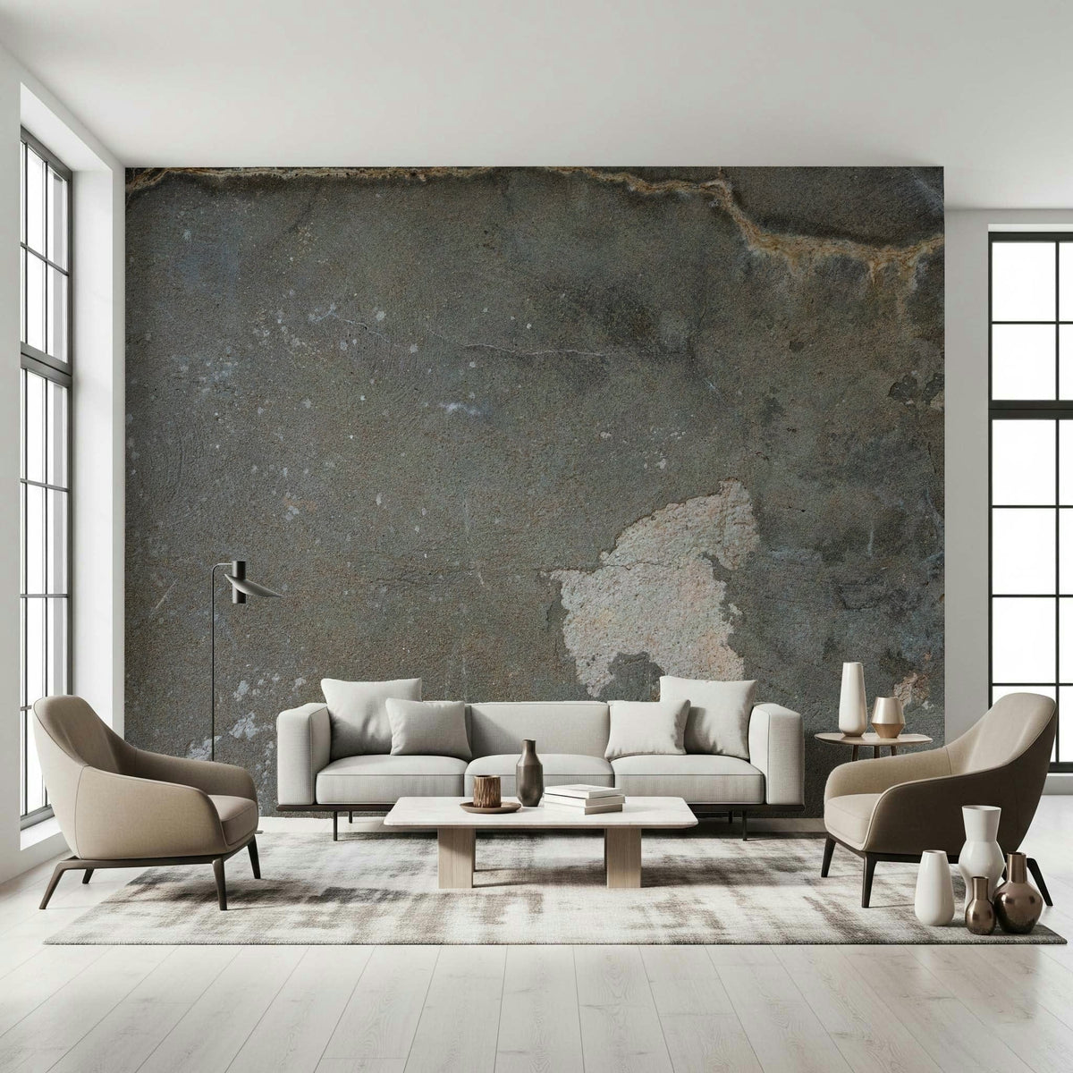 Urban Gray Industrial wallpaper mural in charcoal concrete behind a gray sofa and two taupe armchairs
