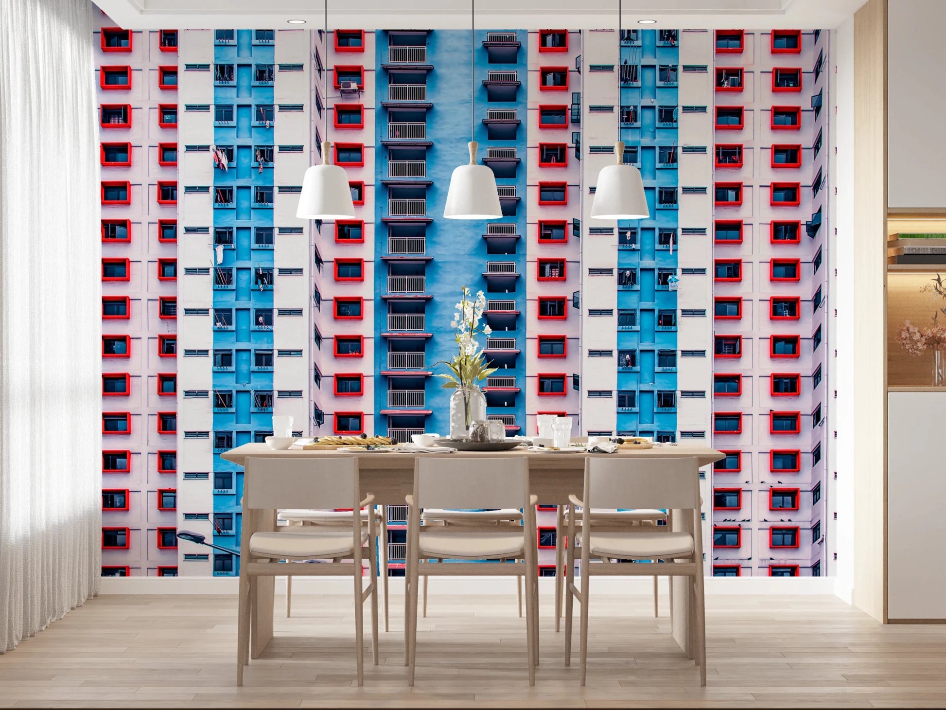 Urban Gridlock wallpaper mural of a high-rise grid behind a dining table with three white pendant lamps