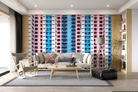 Urban Gridlock wallpaper mural of stacked colorful windows behind a cream sofa and wood rocking chair