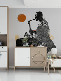 Urban Jazz wallpaper mural of a collage saxophone player above a light wood sideboard and lamp