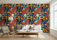 Urban Muse wallpaper behind a white bench sofa and woven lounge chair in a living room