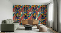 Urban Muse wallpaper behind an olive green sofa and wood sideboard in a bright living room