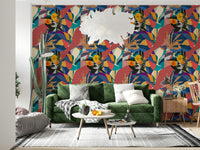Urban Muse wallpaper behind a green velvet sofa with round coffee tables in a living room
