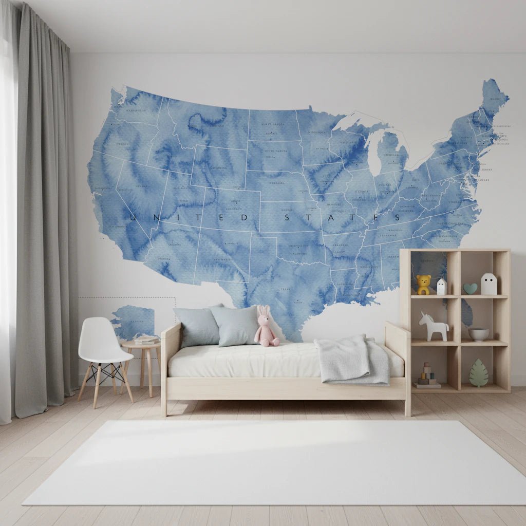 USA map with states and capitals in blue watercolor wallpaper mural in a kids bedroom with a wood bed and toy shelf