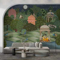 Vanara Vatika wall mural with pink garden pavilions, peacocks and Krishna behind a beige sofa in a living room