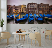 Gloomy overcast Venetian Blues backdrop many parked gondolas stunning decor.