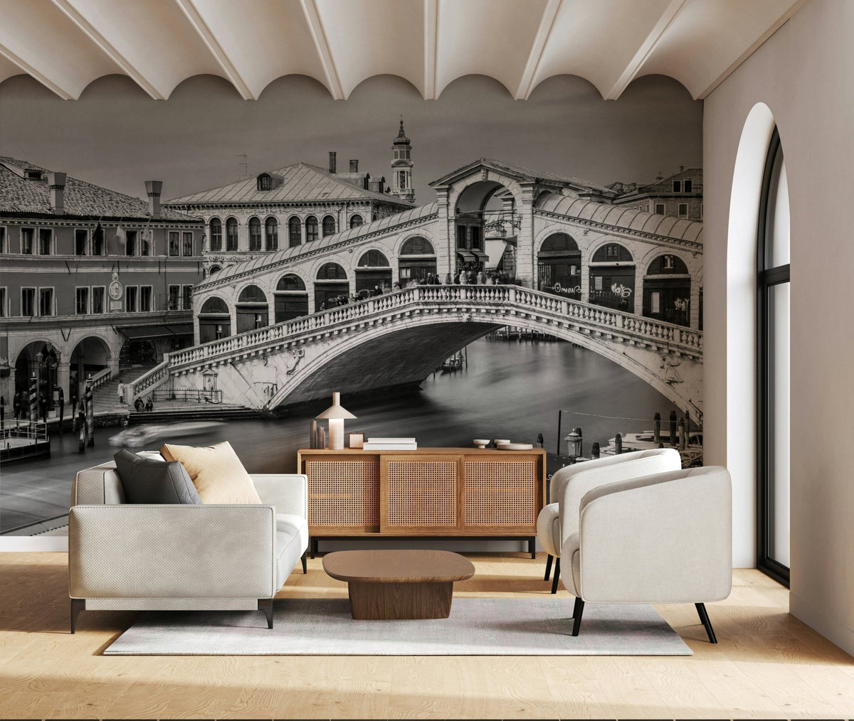Venetian Bridge Serenity wallpaper mural of the black and white Rialto Bridge behind a white sofa and cane sideboard