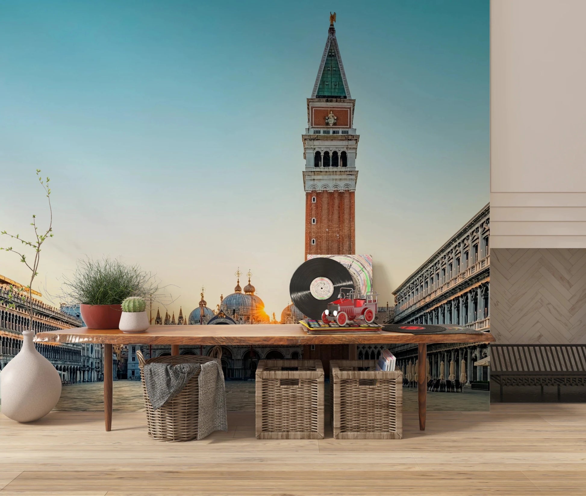 Venetian Sunrise wallpaper mural of St Mark's Square and tower behind a wood table topped with vinyl records