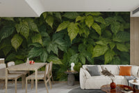 Various types of leaves and tropical plants fill the entire frame.
