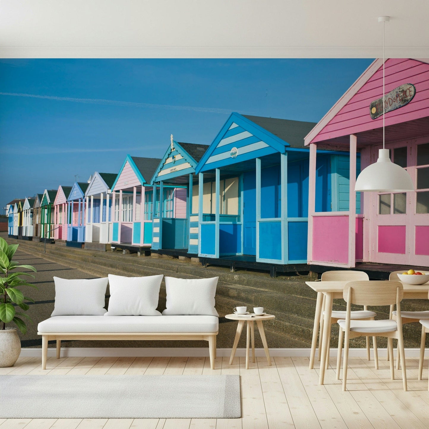 Oceanfront huts wall mural under clear sky