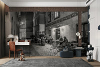 Street cafe in Vienna wallpaper mural of a black and white street cafe behind a red desk and toys in a child's room