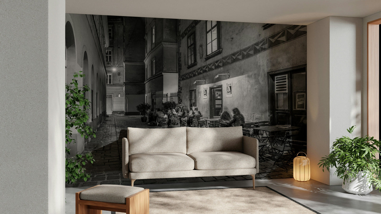 Street cafe in Vienna wallpaper mural of a monochrome evening alley and cafe behind a cream sofa in a living room