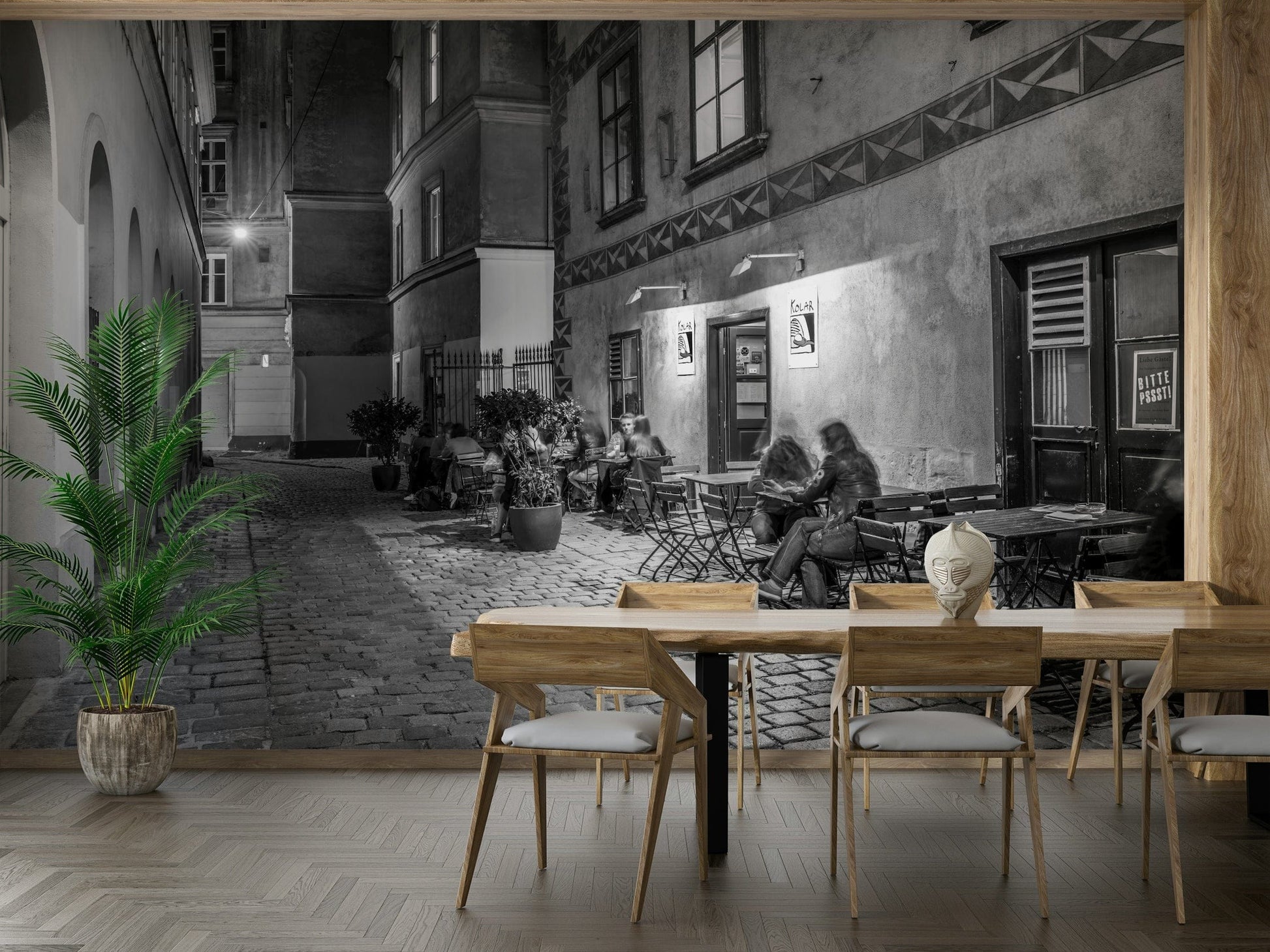 Street cafe in Vienna wallpaper mural of a monochrome cobbled cafe scene behind a wood dining table and chairs