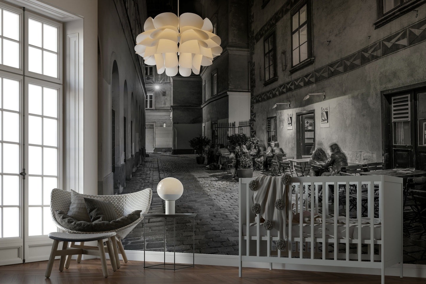 Street cafe in Vienna wallpaper mural of a black and white evening alley and cafe beside a white crib in a nursery