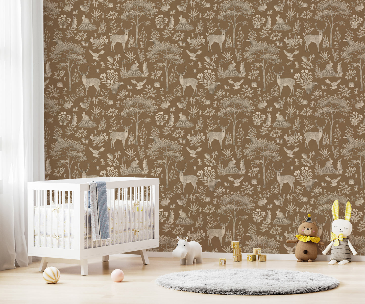 Vintage Brown Wildlife wallpaper in a nursery with a white crib, grey rug and bear and bunny plush toys