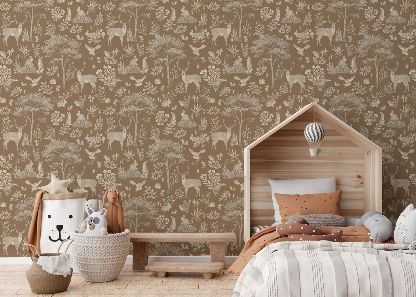 Vintage Brown Wildlife wallpaper behind a wooden house-shaped bed with terracotta bedding and a lion basket