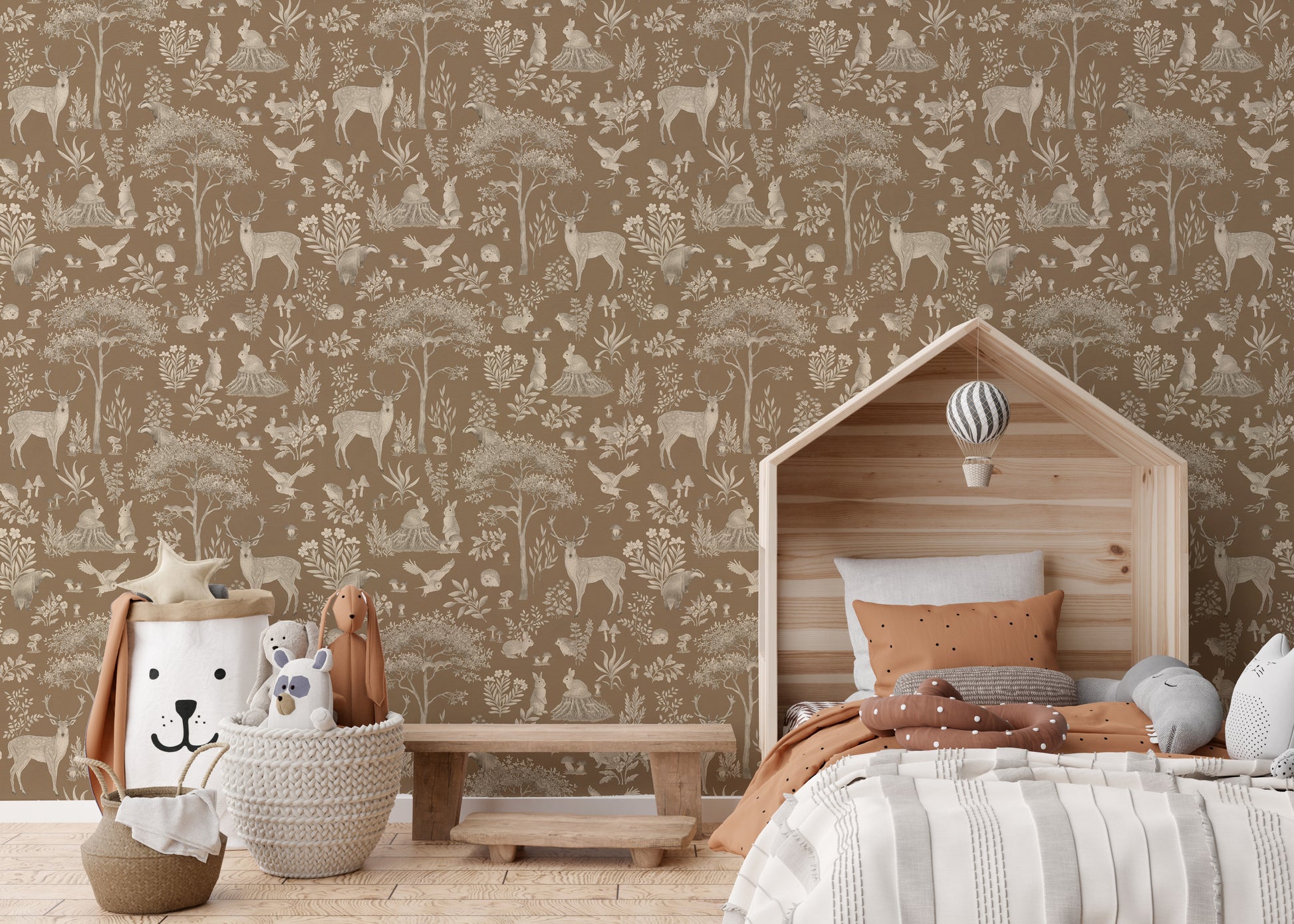 Vintage Brown Wildlife wallpaper behind a wooden house-shaped bed with terracotta bedding and a lion basket