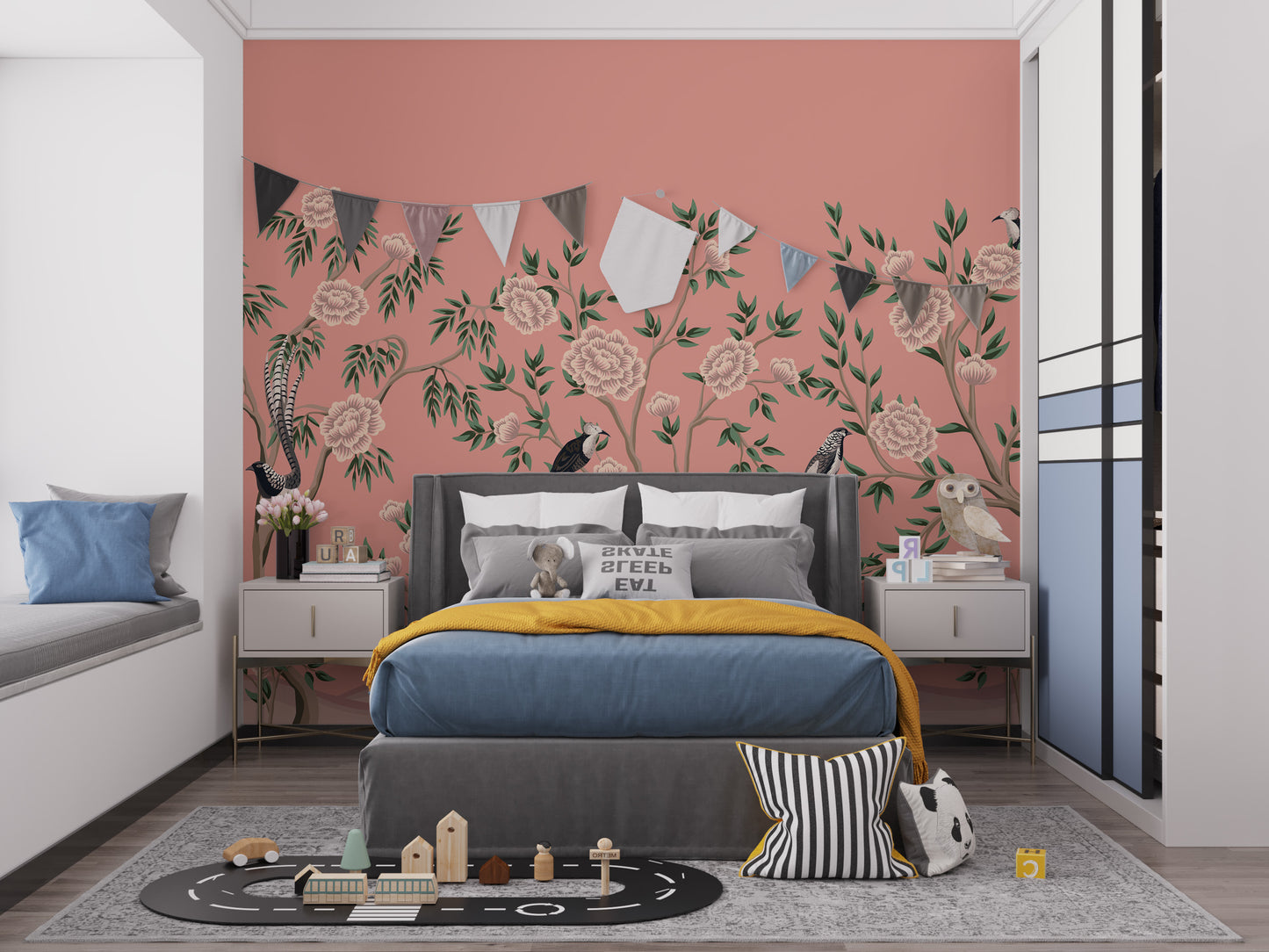 Vintage Chinoiserie Floral wallpaper mural on a coral wall behind a grey kids bed with bunting and a toy road rug