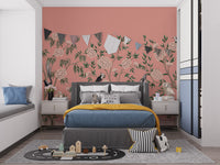 Vintage Chinoiserie Floral wallpaper mural on a coral wall behind a grey kids bed with bunting and a toy road rug