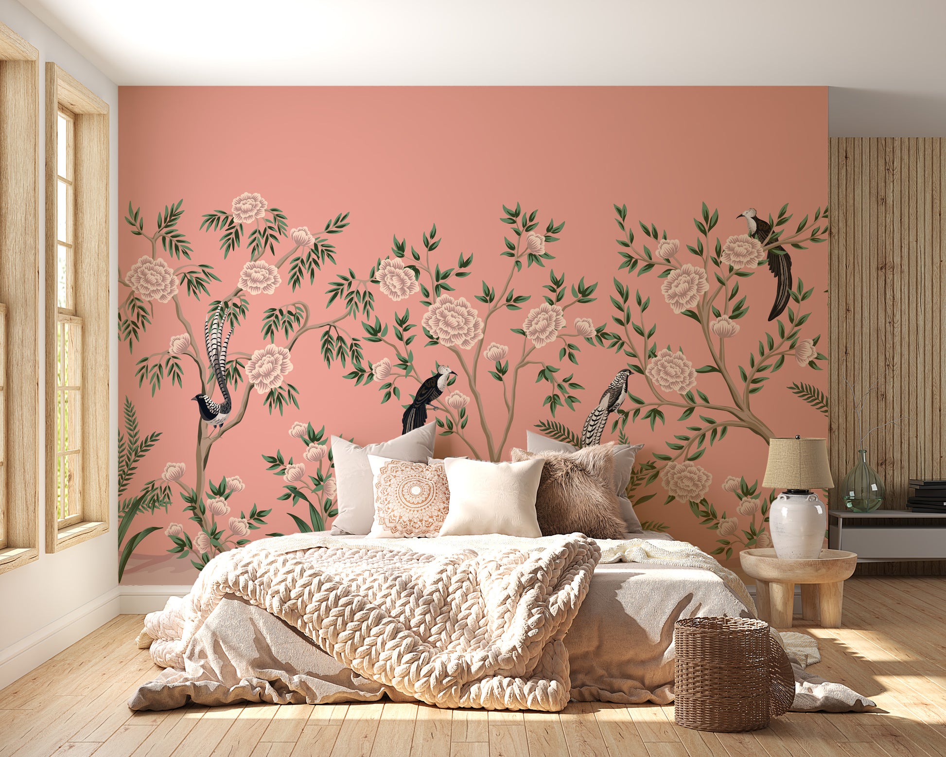 Vintage Chinoiserie Floral wallpaper mural of peach roses and birds above a cozy bed with a chunky knit throw