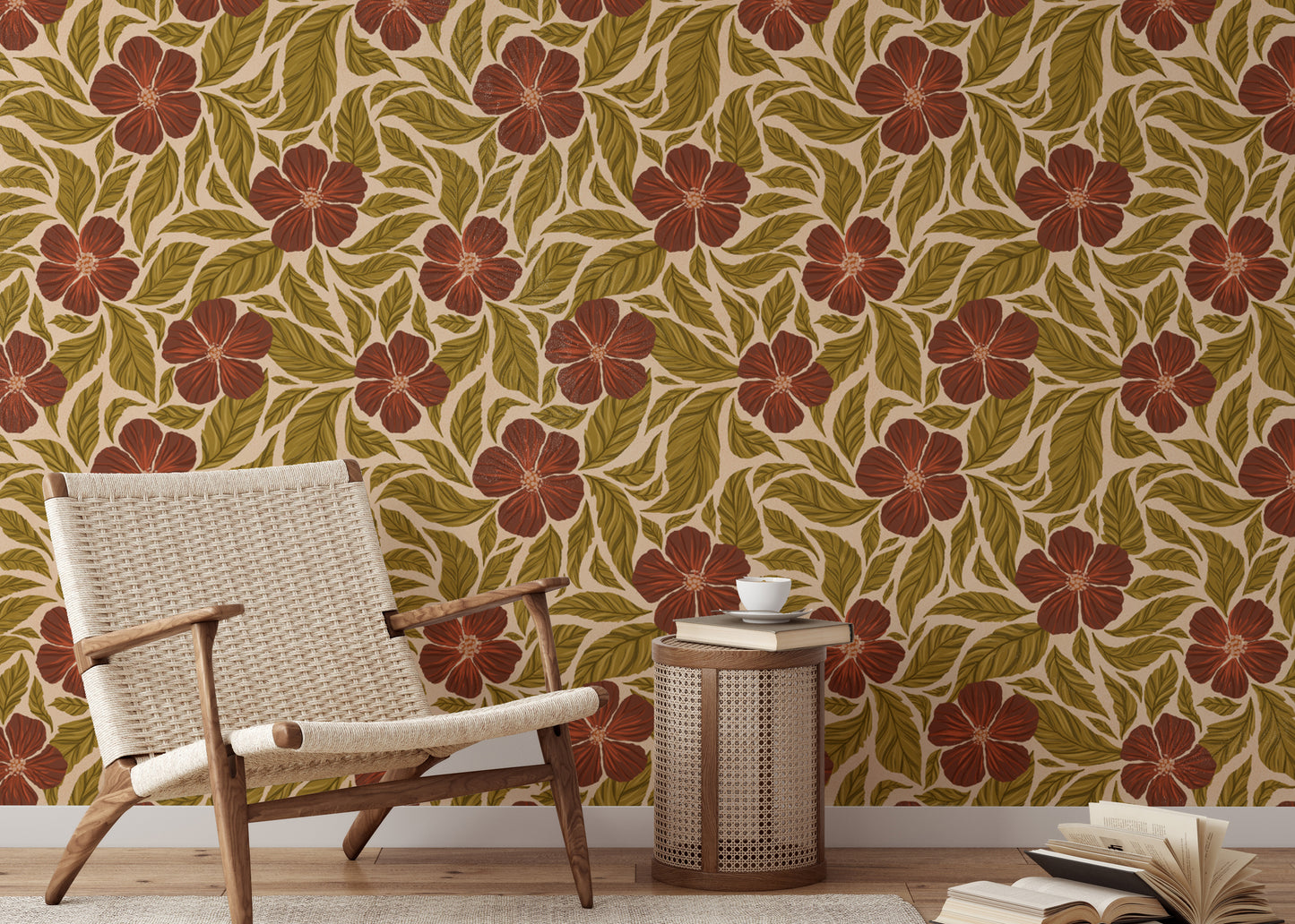 Vintage Flowers Dance wallpaper, rust blooms and green leaves behind a woven wood chair in a living room