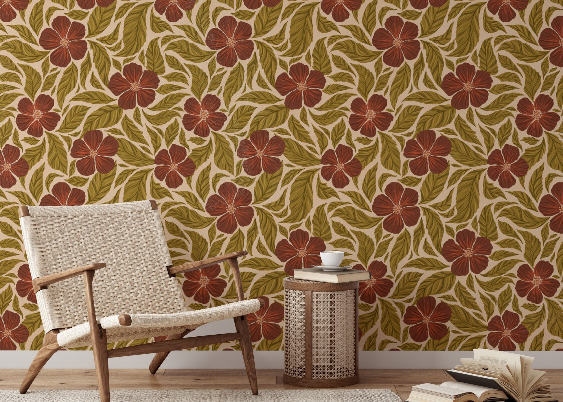 Vintage Flowers Dance wallpaper, rust blooms and green leaves behind a woven wood chair in a living room