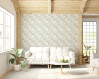 Vintage Folk Tiles Sage Green wallpaper behind a white plush sofa under a wood-beam ceiling in a living room