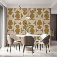 Geometric wallpaper with symmetrical arcs and circles in soft green, cream, and mustard shades.