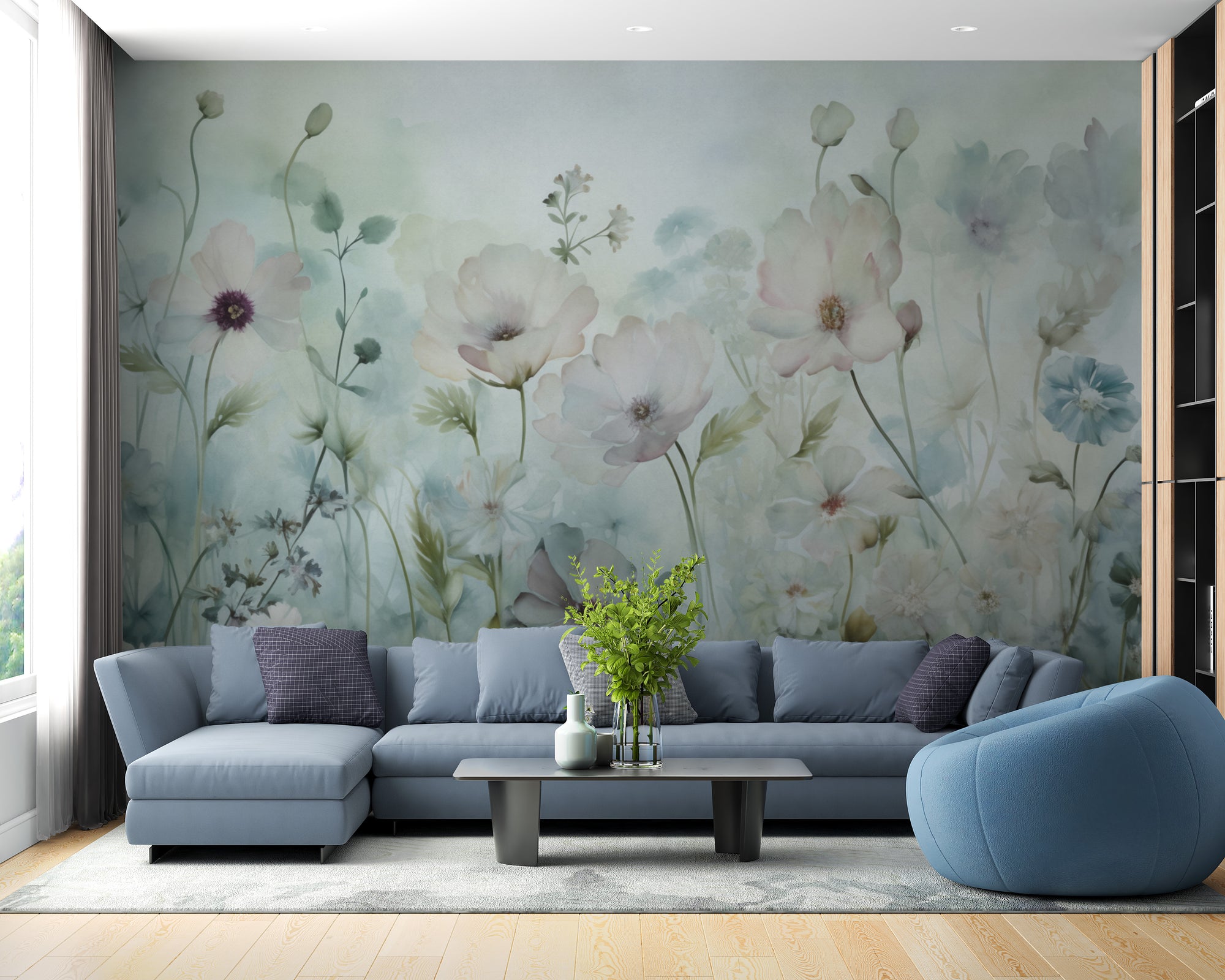 Spring Field Vintage Green wallpaper mural of soft wildflowers behind a blue-grey sectional sofa in a living room