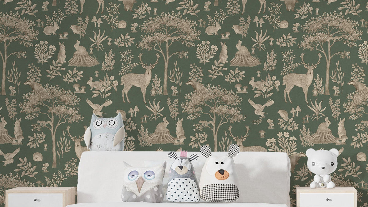 Vintage Green Wildlife wallpaper behind a white bed with owl and bear plush cushions in a kids bedroom