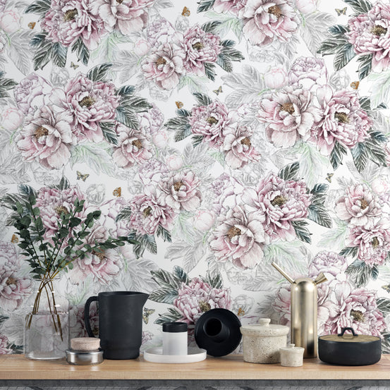 Vintage Peony Floral wallpaper mural in pink and sage behind a wood shelf with black pitcher and brass decor