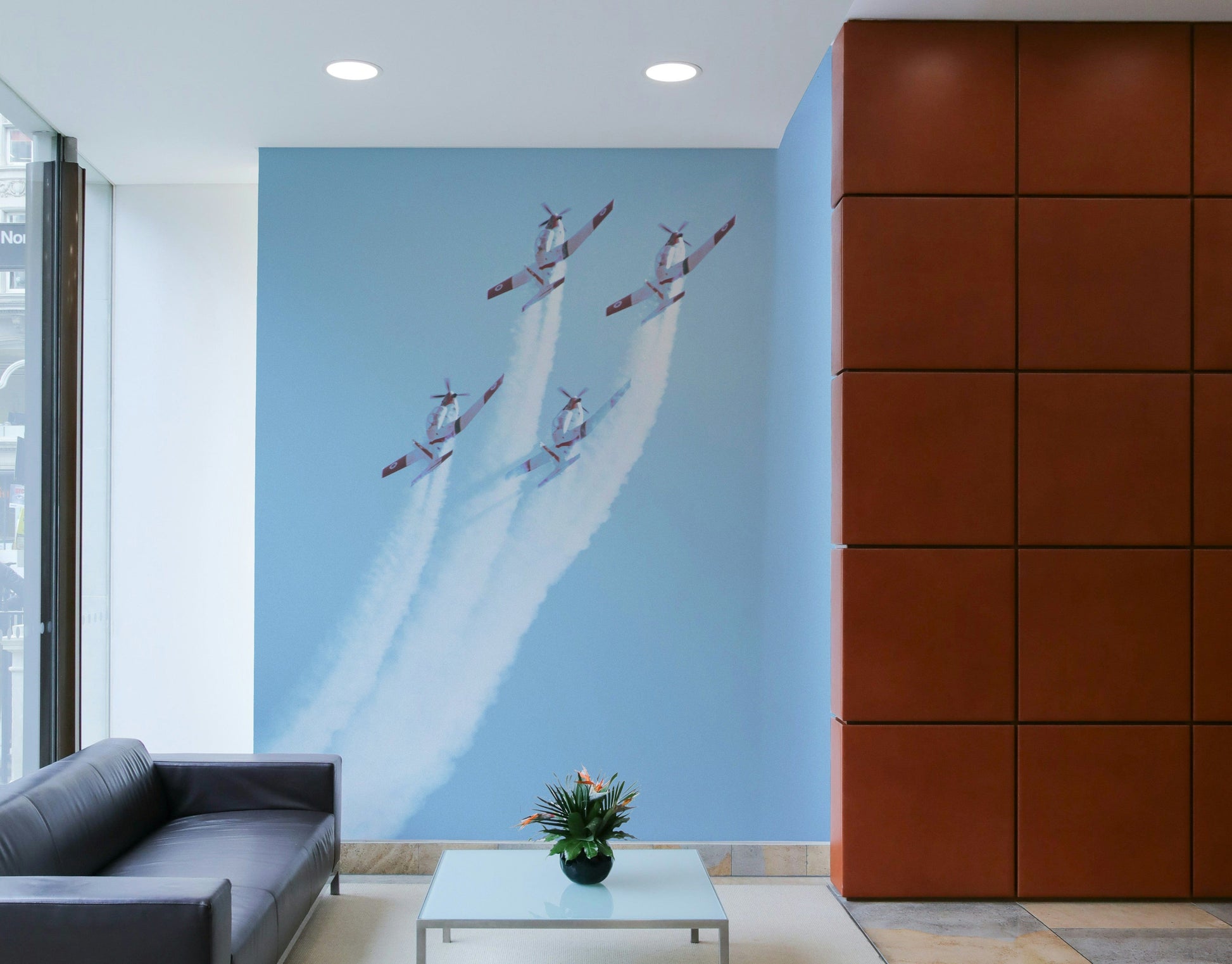An artistic military plane mural on minimalist wallpaper.

