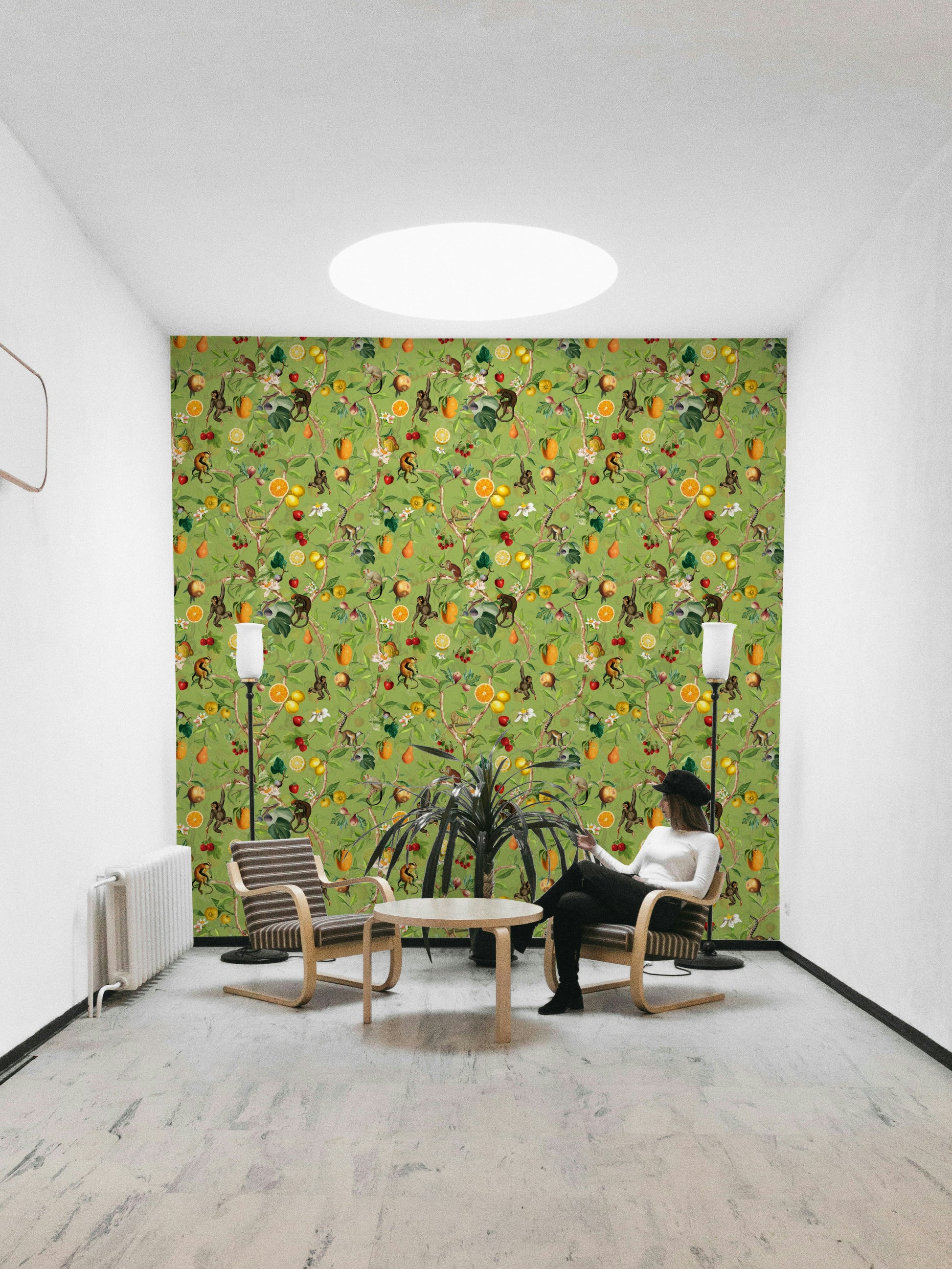 Tropical wallpaper with monkeys perched among flowers and vines.

