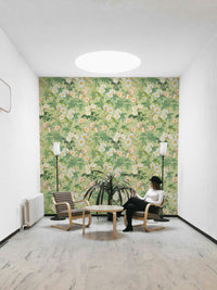 Floral mural with soft, pastel roses and rich green botanical details.

