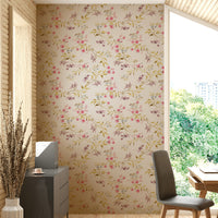 Close-up of roses and vines in a soft vintage floral wallpaper.

