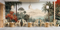 Verdant Valley Vintage Tropical Flora mural of palms and mountains above rattan tables and chairs in a cafe