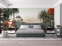 Verdant Valley Vintage Tropical Flora mural of palms and red blooms behind a sage green bed in a bedroom