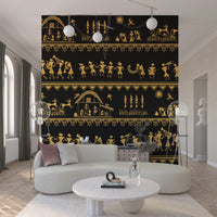 Warli-inspired mural artwork in monochrome gold detailing village stories